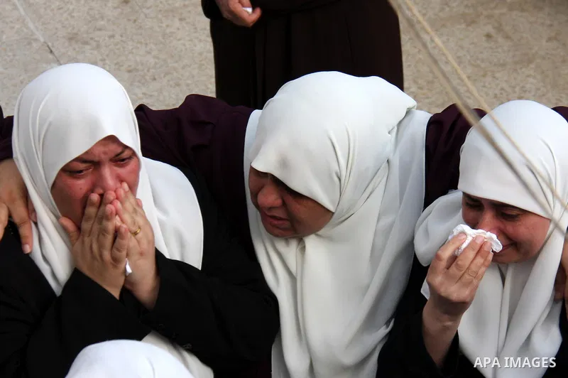Palestinians mourn the body of senior Hamas militant Nashat al-Karmi during his funeral, in the West Bank city of Tulkarem, Friday, Oct. 8, 2010. Israeli troops killed two senior Hamas militants in an early-morning raid...