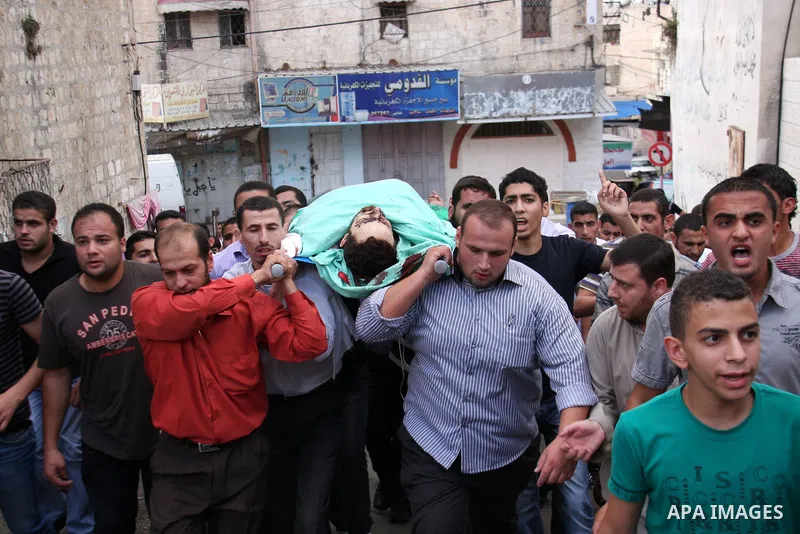 Palestinians carry the body of senior Hamas militant Nashat al-Karmi during his funeral, in the West Bank city of Tulkarem, Friday, Oct. 8, 2010. Israeli troops killed two senior Hamas militants in an early-morning raid...