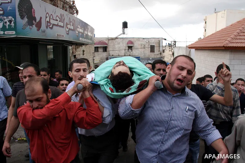 Palestinians carry the body of senior Hamas militant Nashat al-Karmi during his funeral, in the West Bank city of Tulkarem, Friday, Oct. 8, 2010. Israeli troops killed two senior Hamas militants in an early-morning raid...