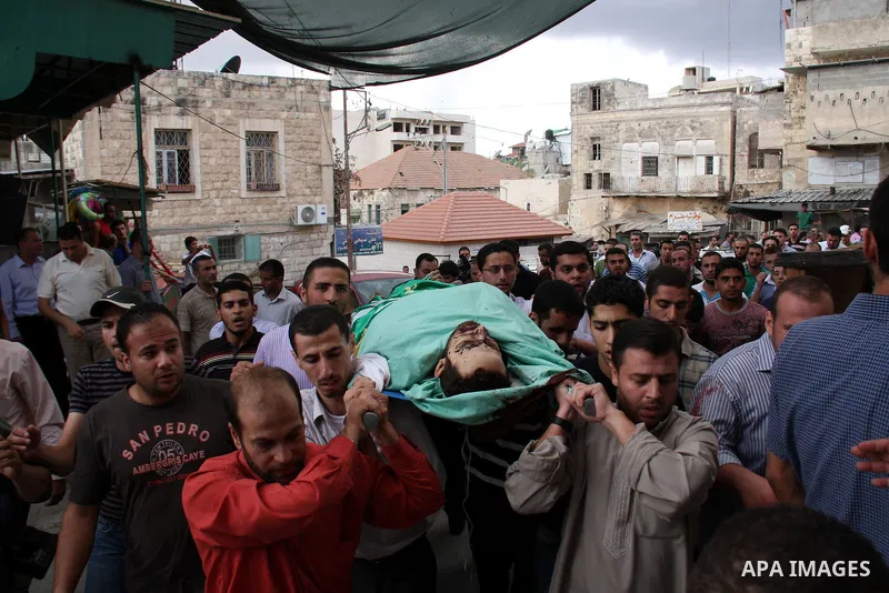 Palestinians carry the body of senior Hamas militant Nashat al-Karmi during his funeral, in the West Bank city of Tulkarem, Friday, Oct. 8, 2010. Israeli troops killed two senior Hamas militants in an early-morning raid...