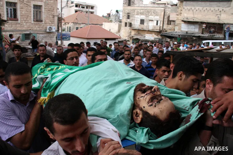 Palestinians carry the body of senior Hamas militant Nashat al-Karmi during his funeral, in the West Bank city of Tulkarem, Friday, Oct. 8, 2010. Israeli troops killed two senior Hamas militants in an early-morning raid...