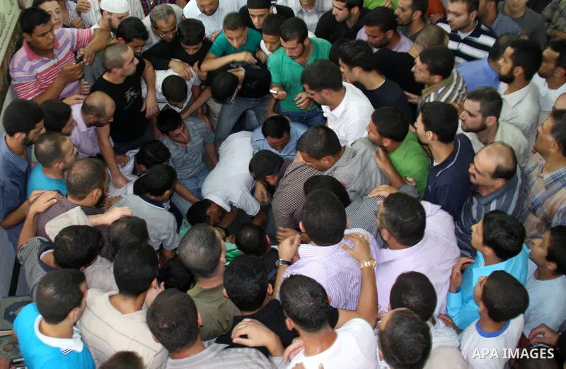 Palestinians carry the body of senior Hamas militant Nashat al-Karmi during his funeral, in the West Bank city of Tulkarem, Friday, Oct. 8, 2010. Israeli troops killed two senior Hamas militants in an early-morning raid...