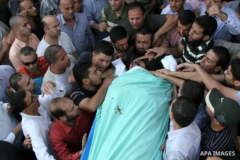 Palestinians carry the body of senior Hamas militant Nashat al-Karmi during his funeral, in the West Bank city of Tulkarem, Friday, Oct. 8, 2010. Israeli troops killed two senior Hamas militants in an early-morning raid...