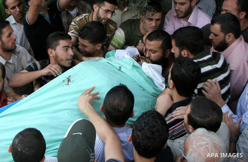 Palestinians carry the body of senior Hamas militant Nashat al-Karmi during his funeral, in the West Bank city of Tulkarem, Friday, Oct. 8, 2010. Israeli troops killed two senior Hamas militants in an early-morning raid...