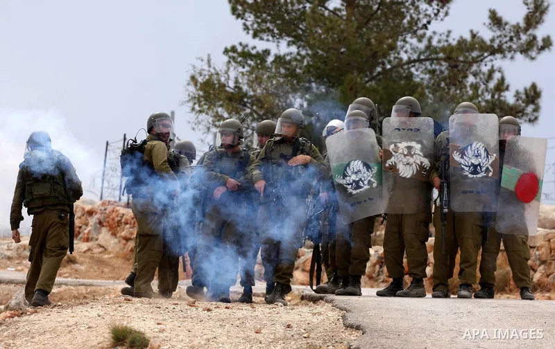 Israeli soldiers fire tear gas canisters during the clashes following a weekly demonstration against Israel's separation barrier in the West Bank village of Bilin, near Ramallah, on Oct. 8, 2010. Photo by Eyad Jadallah