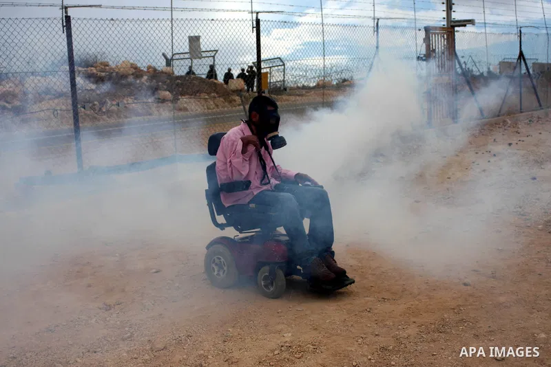 Israeli soldiers fire tear gas canisters during the clashes following a weekly demonstration against Israel's separation barrier in the West Bank village of Bilin, near Ramallah, on Oct. 8, 2010. Photo by Eyad Jadallah