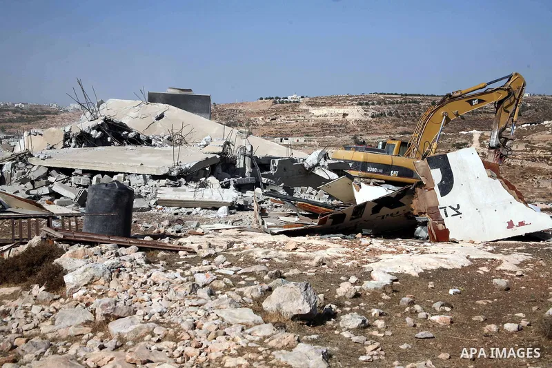 Israeli army bulldozer destroying a Palestinian house and water wells that belong to Rugby family , just east of the West Bank town of Hebron on October 11,2010 . Direct peace talks between the Palestinians and Israel ha...