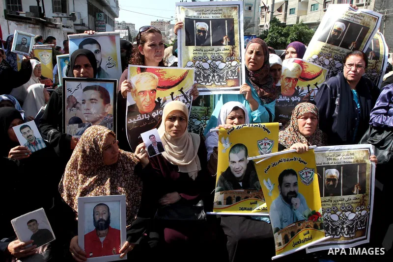 Palestinians attend a protest calling for the release of Palestinian prisoners from Israeli jails , in Gaza City on October 11, 2010. About 7,500 Palestinian prisoners are held in Israeli jails, according to the Palestin...
