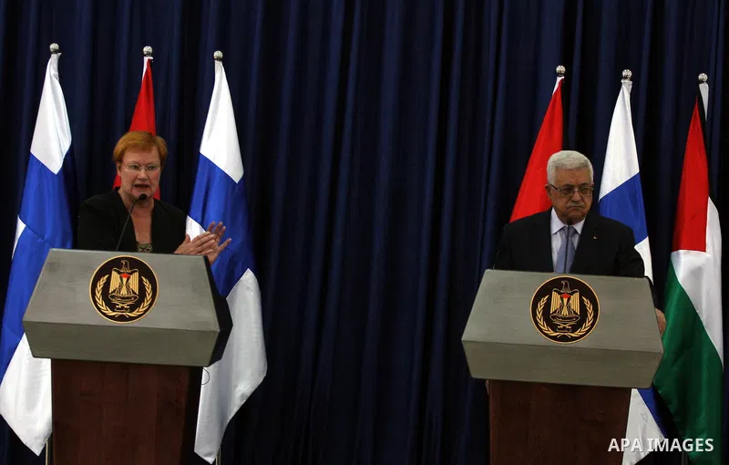 Palestinian President Mahmoud Abbas, holds a joint press conference with Finnish President Tarja Halonen after a meeting in the West Bank city of Ramallah, Tuesday,October 14, 2010. Photo by Issam Rimawi