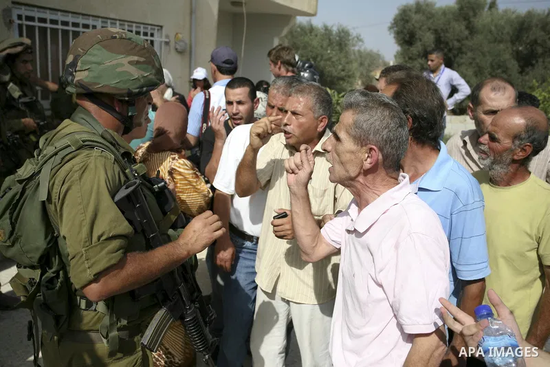 Palestinians scuffle with Israeli border policemen during clashes in the West Bank village of Nabi Saleh, on 22 October 2010. Palestinians protest weekly against the neighbouring Jewish settlement of Halamish. Photo by E...