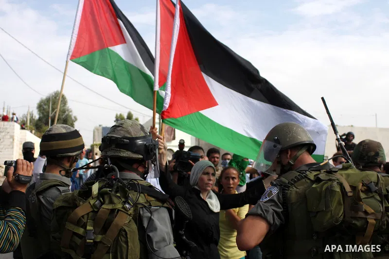 Palestinians scuffle with Israeli border policemen during clashes in the West Bank village of Nabi Saleh, on 22 October 2010. Palestinians protest weekly against the neighbouring Jewish settlement of Halamish. Photo by I...