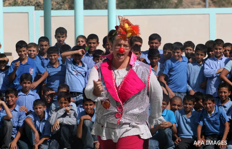 Palestinian schoolchildren watch a performance presented by the British circus at a school in Biet Lahia in the northern of Gaza Strip on Oct. 25, 2010. The British circus recently arrived to the Gaza Strip to present a...