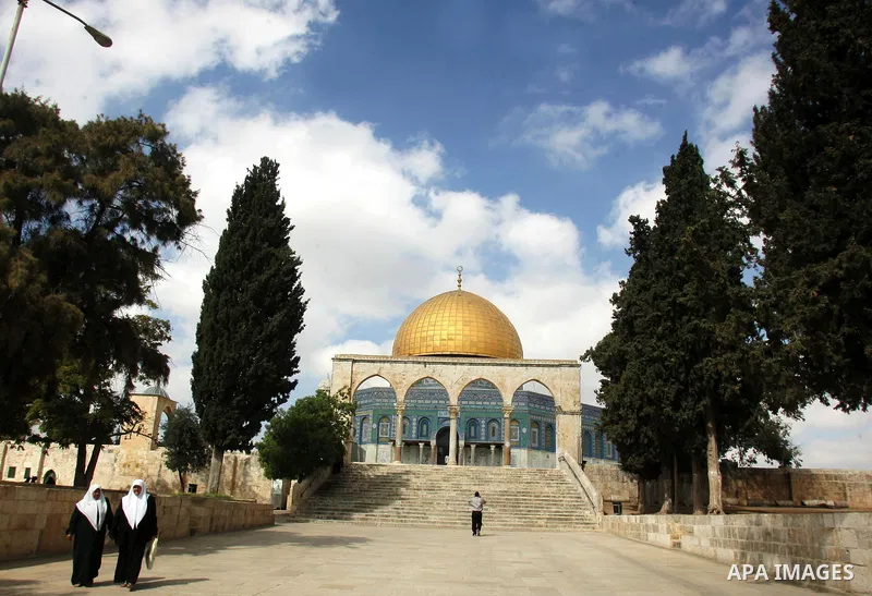 Palestinians walk in front of the Dome of Rock in the Al Aqsa Mosque compound, also known to Jews as the Temple Mount, in Jerusalem's old city on Oct. 25, 2010. Photo by Mahfouz Abu Turk