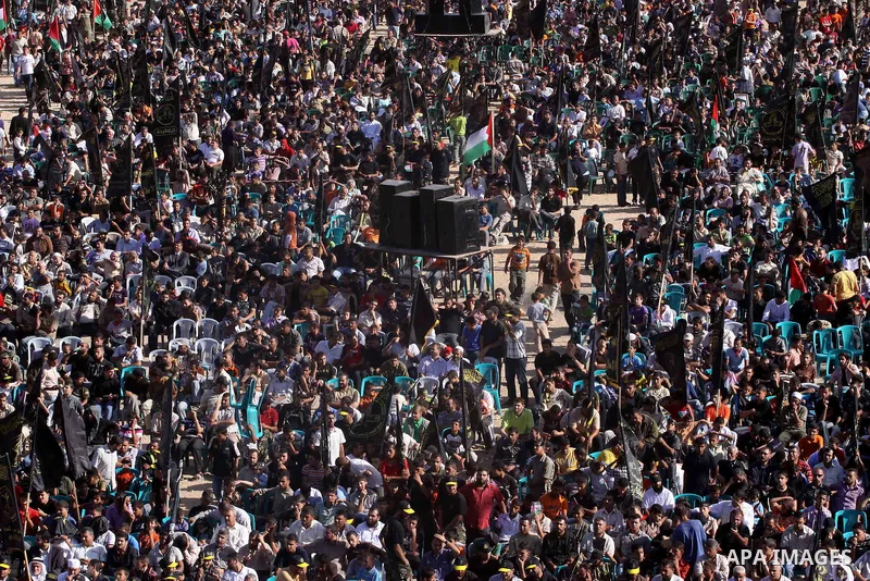 Palestinian Islamic Jihad supporters attend a rally to mark the 23rd anniversary of the establishment of the Islamic Jihad movement and the assassination of the founder of their movement Fathi Shiqaqi , in Gaza city on O...
