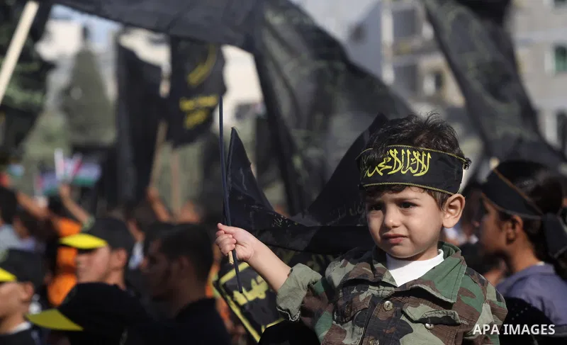 Palestinian Islamic Jihad supporters attend a rally to mark the 23rd anniversary of the establishment of the Islamic Jihad movement and the assassination of the founder of their movement Fathi Shiqaqi , in Gaza city on O...