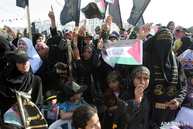 Palestinian Islamic Jihad supporters attend a rally to mark the 23rd anniversary of the establishment of the Islamic Jihad movement and the assassination of the founder of their movement Fathi Shiqaqi , in Gaza city on O...