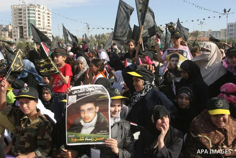 Palestinian Islamic Jihad supporters attend a rally to mark the 23rd anniversary of the establishment of the Islamic Jihad movement and the assassination of the founder of their movement Fathi Shiqaqi , in Gaza city on O...