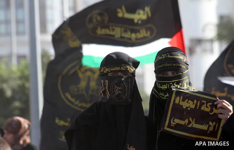 Palestinian Islamic Jihad supporters attend a rally to mark the 23rd anniversary of the establishment of the Islamic Jihad movement and the assassination of the founder of their movement Fathi Shiqaqi , in Gaza city on O...