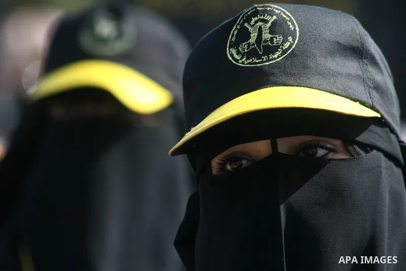 Palestinian Islamic Jihad supporters attend a rally to mark the 23rd anniversary of the establishment of the Islamic Jihad movement and the assassination of the founder of their movement Fathi Shiqaqi , in Gaza city on O...