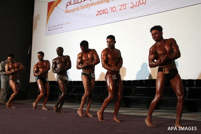 Palestinian athletes take part in a local bodybuilding competition in Gaza City on October 29, 2010. Photo by Ashraf Amra