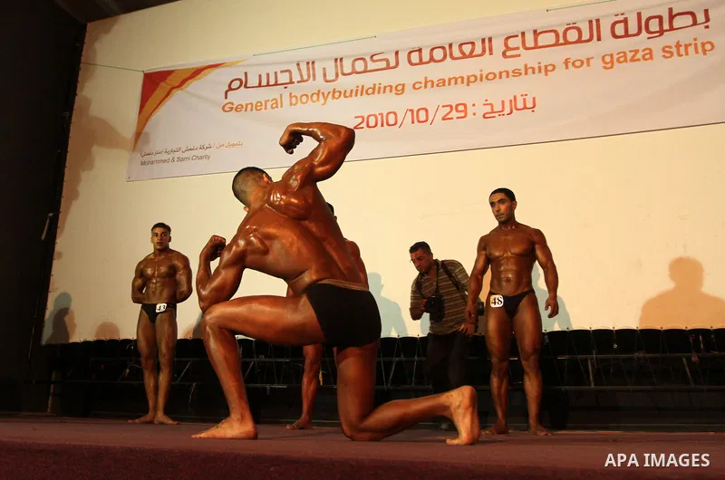 Palestinian athletes take part in a local bodybuilding competition in Gaza City on October 29, 2010. Photo by Ashraf Amra