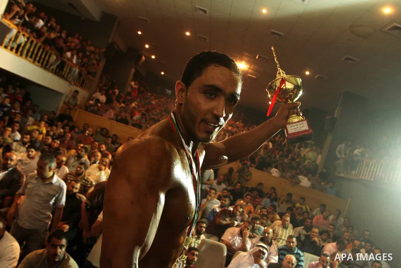 Palestinian athletes take part in a local bodybuilding competition in Gaza City on October 29, 2010. Photo by Ashraf Amra