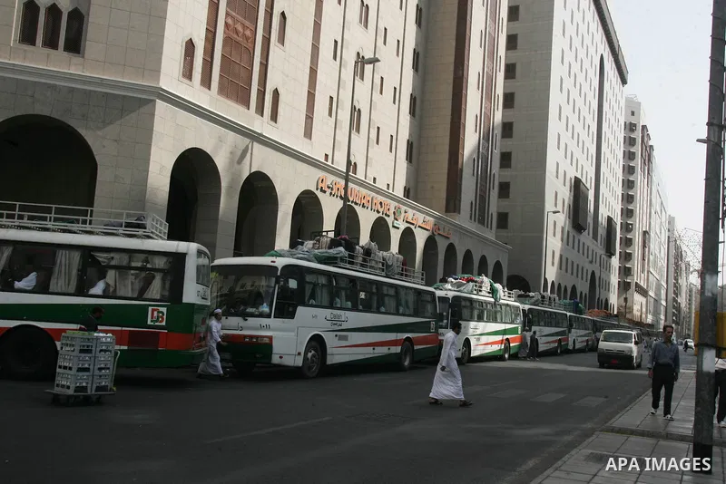 Muslim pilgrims walk outside the Prophet Mohammed Mosque in the Saudi holy city of Medina on November 3, 2010. More than three million Muslims are expected to converge on the holy cities of Mecca and Medina in western Sa...