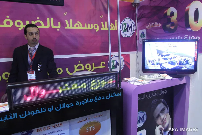 Palestinians attend to the Expotech exhibition for telecom and information technology , in Gaza City on Nov. 4,2010 . Photo by Mohammed Asad