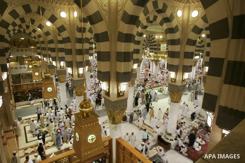 Muslim pilgrims pray inside the Prophet Mohammed Mosque in the Saudi holy city of Medina on November 4, 2010. More than three million Muslims are expected to converge on the holy cities of Mecca and Medina in western Sau...
