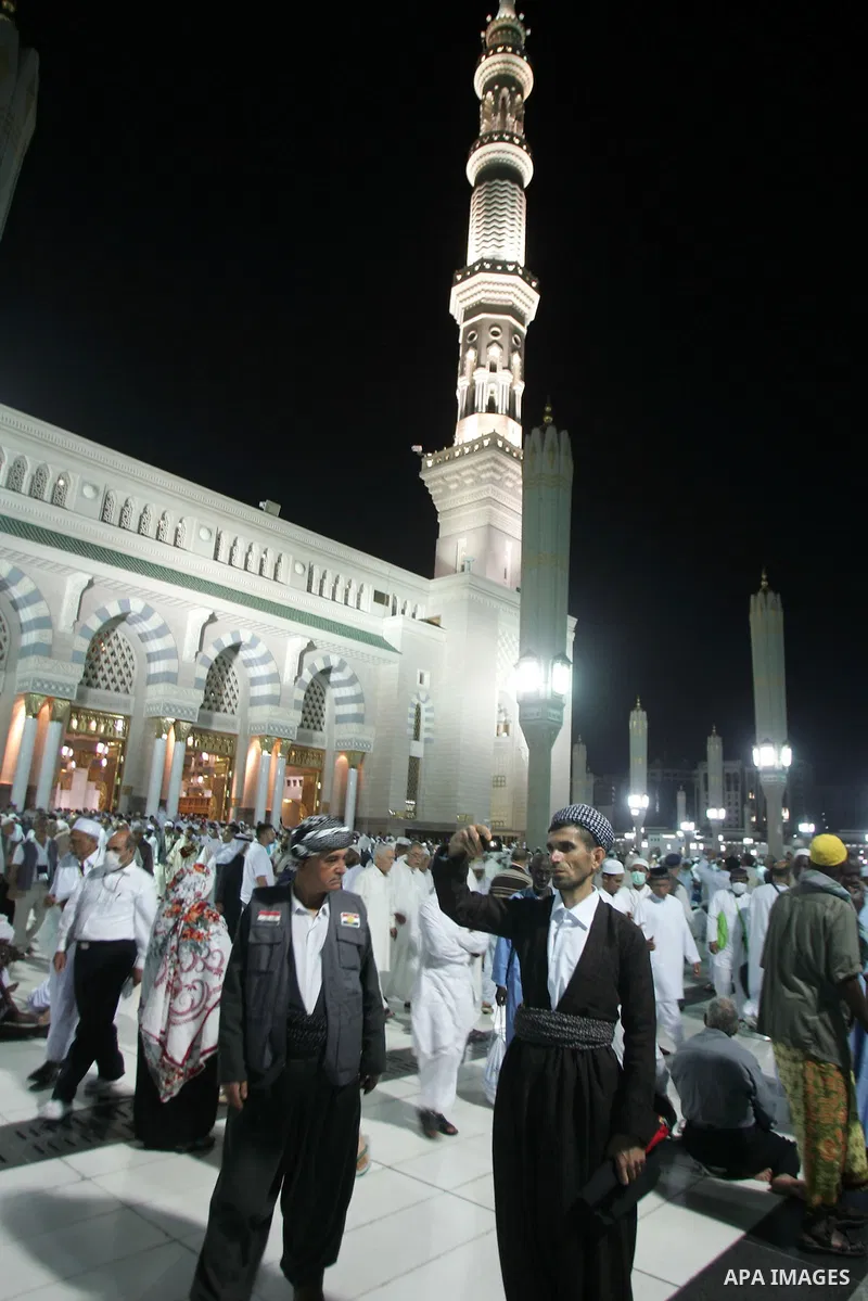 Muslim pilgrims walk outside the Prophet Mohammed Mosque in the Saudi holy city of Medina on November 4, 2010. More than three million Muslims are expected to converge on the holy cities of Mecca and Medina in western Sa...