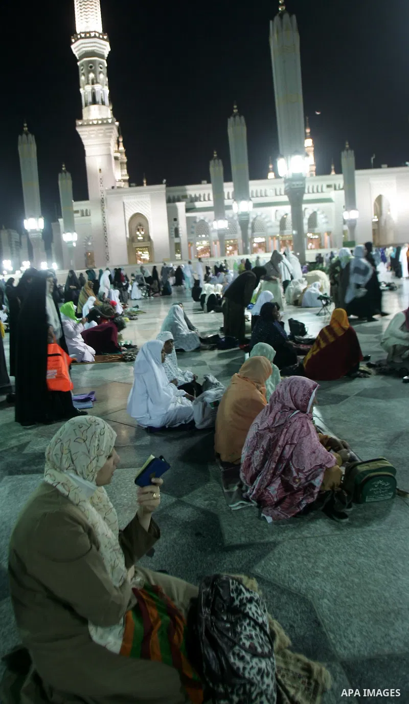 Muslim pilgrims pray outside the Prophet Mohammed Mosque in the Saudi holy city of Medina on November 4, 2010. More than three million Muslims are expected to converge on the holy cities of Mecca and Medina in western Sa...