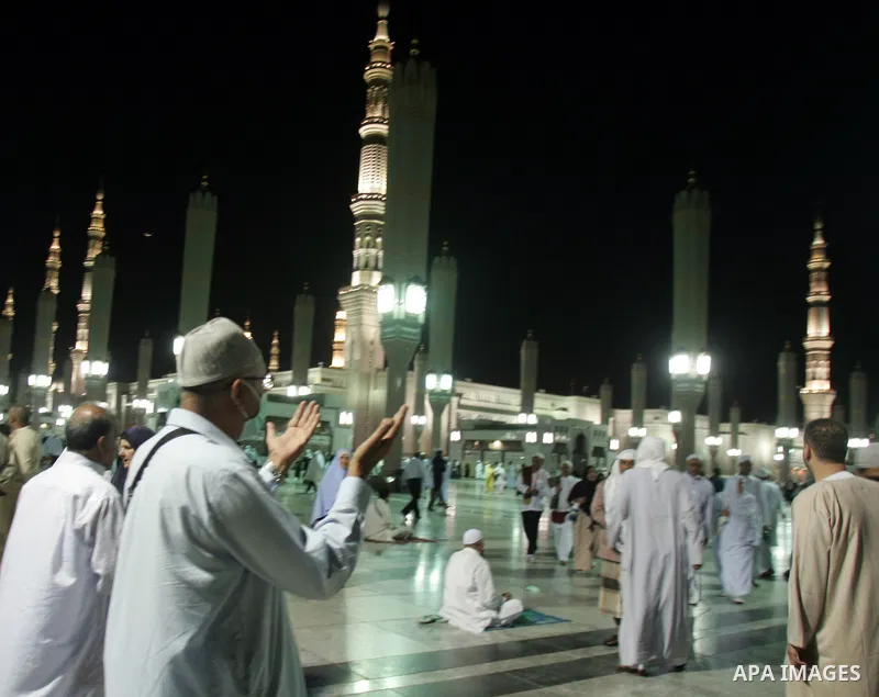 Muslim pilgrims pray outside the Prophet Mohammed Mosque in the Saudi holy city of Medina on November 4, 2010. More than three million Muslims are expected to converge on the holy cities of Mecca and Medina in western Sa...