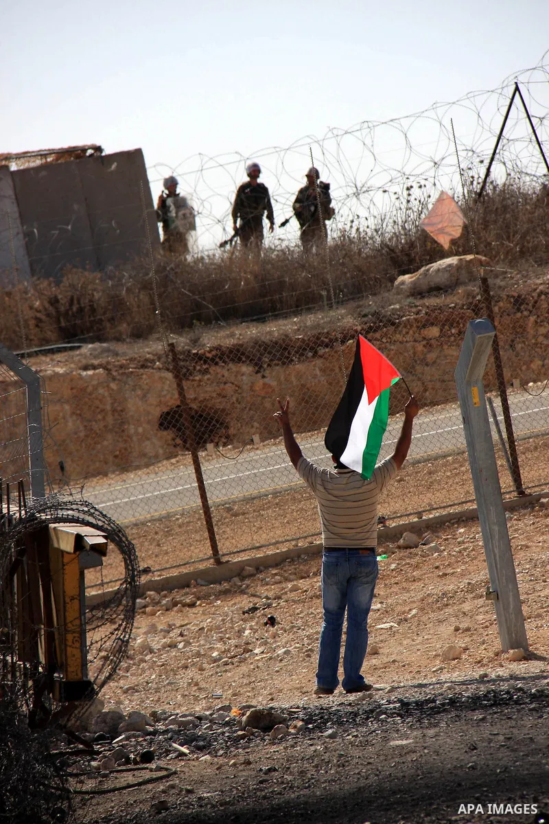 Israeli soldiers take position during a demonstration by Palestinians against Israel's separation barrier in the West Bank village of Bilin near Ramallah, Friday,Nov. 4, 2010. Photo by Wagdi Eshtayah