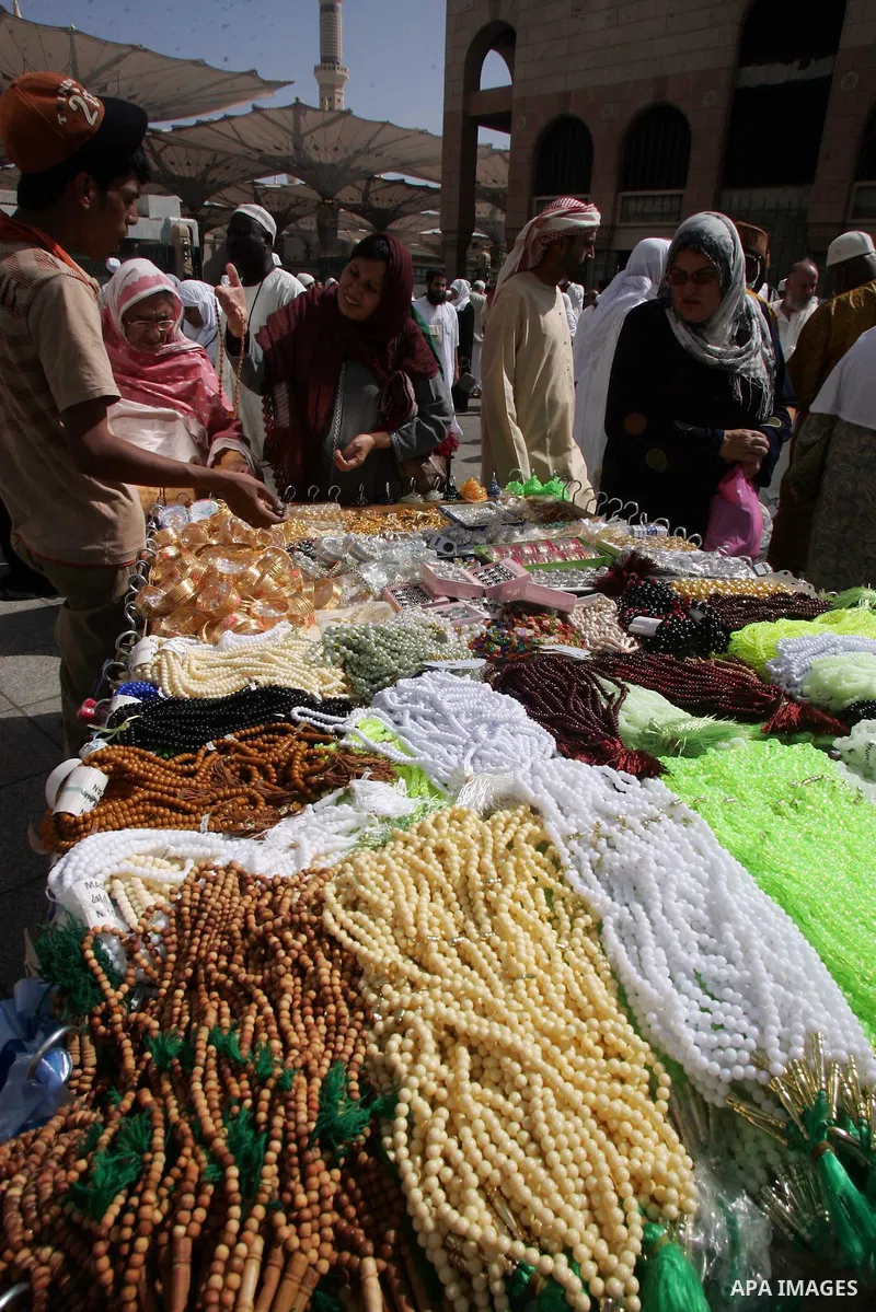Saudi man sells belongings of pilgrims outside the Prophet Mohammed Mosque in the Saudi holy city of Medina on November 5, 2010. More than three million Muslims are expected to converge on the holy cities of Mecca and Me...