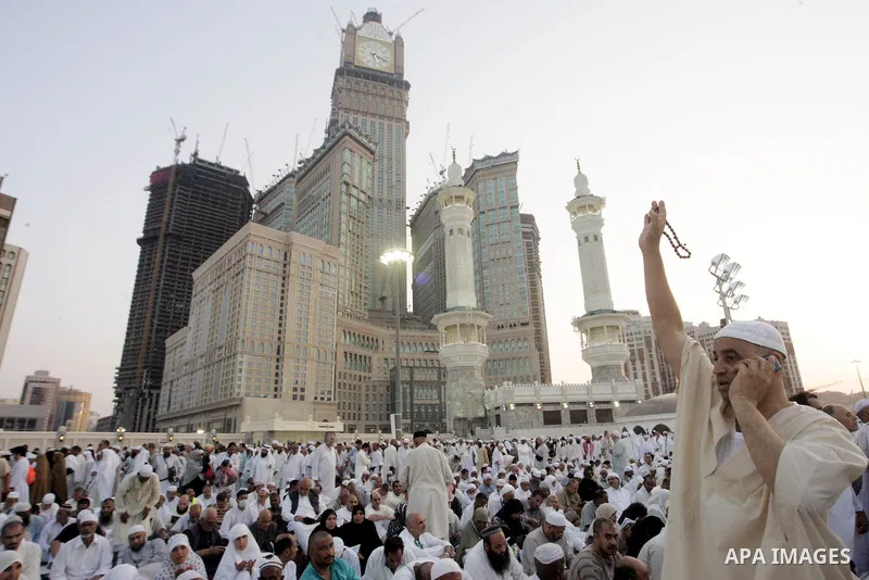 Muslim pilgrims sit outside the Grand Mosque during the annual Hajj in Mecca, Saudi Arabia, Nov 7, 2010. Some 2.5 million Muslims from more than 160 countries converge annually on the Islamic cities of Mecca and Medina i...