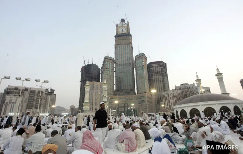 Muslim pilgrims sit outside the Grand Mosque during the annual Hajj in Mecca, Saudi Arabia, Nov 7, 2010. Some 2.5 million Muslims from more than 160 countries converge annually on the Islamic cities of Mecca and Medina i...