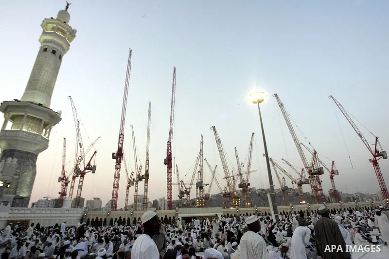 Muslim pilgrims sit outside the Grand Mosque during the annual Hajj in Mecca, Saudi Arabia, Nov 7, 2010. Some 2.5 million Muslims from more than 160 countries converge annually on the Islamic cities of Mecca and Medina i...