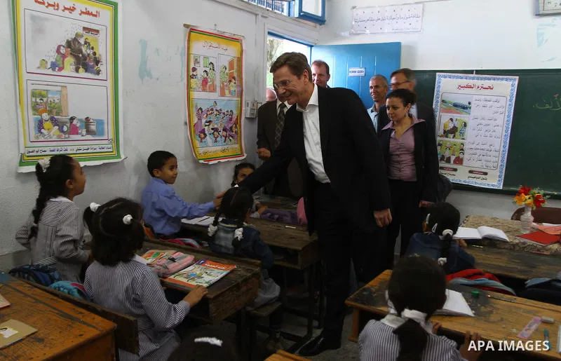German Foreign Minister Guido Westerwelle talk with refugees students during his visit to Al Shatea school in the west of Gaza City on 08 November 2010. Visting German Foreign Minister Guiido Westerwelle on Monday called...