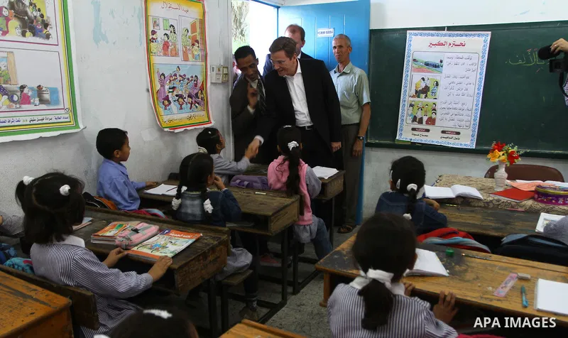 German Foreign Minister Guido Westerwelle talk with refugees students during his visit to Al Shatea school in the west of Gaza City on 08 November 2010. Visting German Foreign Minister Guiido Westerwelle on Monday called...