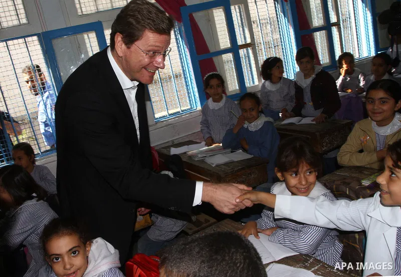 German Foreign Minister Guido Westerwelle talk with refugees students girls during his visit to Al Shatea school in the west of Gaza City on 08 November 2010. Visting German Foreign Minister Guiido Westerwelle on Monday...