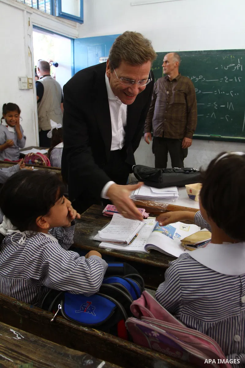German Foreign Minister Guido Westerwelle talk with refugees students girls during his visit to Al Shatea school in the west of Gaza City on 08 November 2010. Visting German Foreign Minister Guiido Westerwelle on Monday...