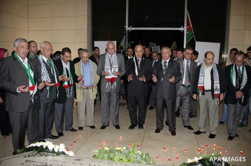 Members of the Central Committee of Fatah movement, lighting candles at the tomb of late President Yasser Arafat in the West Bank city of Ramallah on Nov. 10,2010 . Photo by Omar Rashidi
