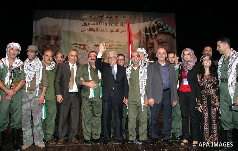 Palestinian President Mahmoud Abbas attends a celebration held by the lovers team in Ramallah Cultural Palace, to mark the sixth anniversary of late Palestinian leader Yasser Arafat death in the West Bank city of Ramalla...