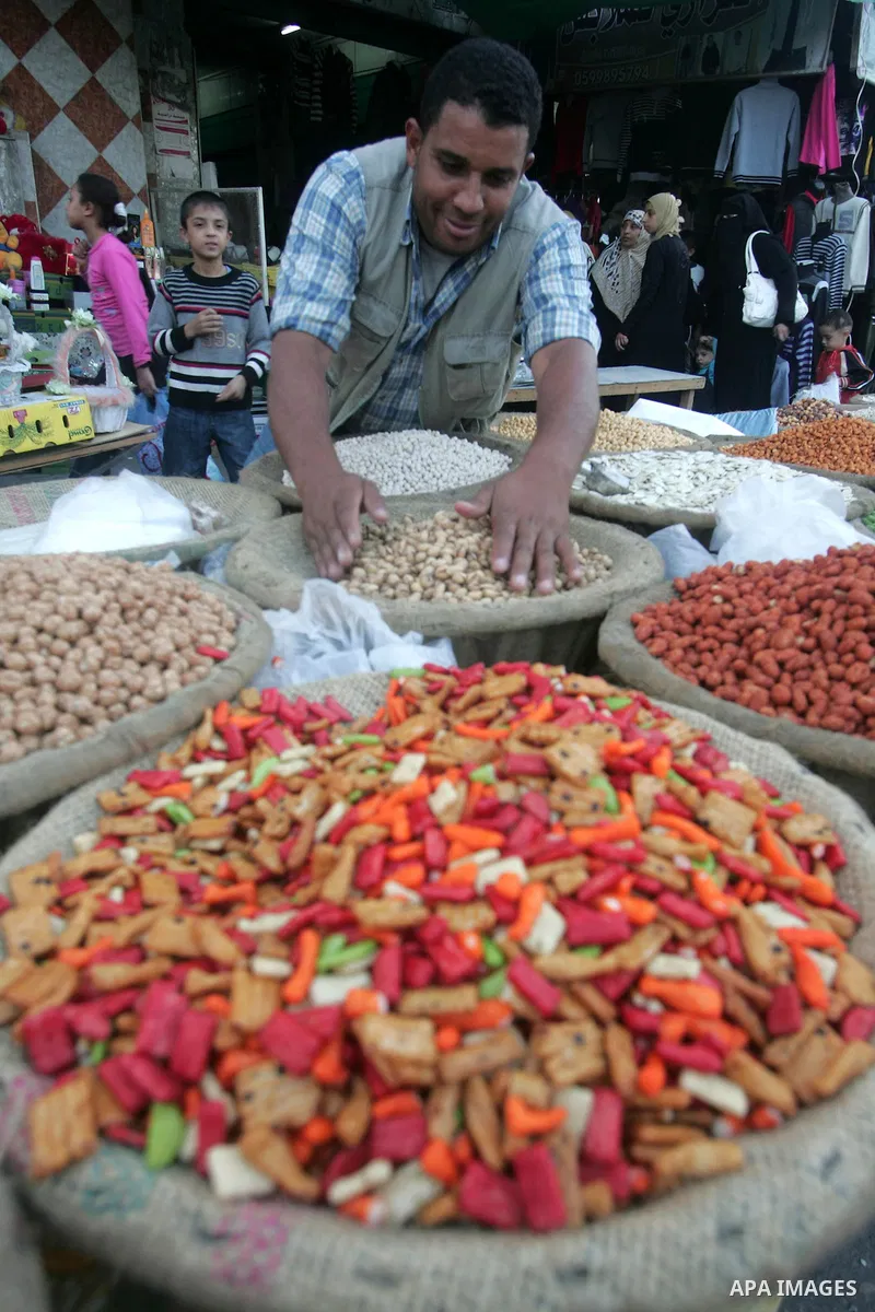 Palestinians shop at a market in the southern Gaza Strip town of Rafah on 14 November 2010, in preparation for the Muslim holiday of Eid al-Adha or the Feast of Sacrifice, which marks the end of the annual pilgrimage. Ph...