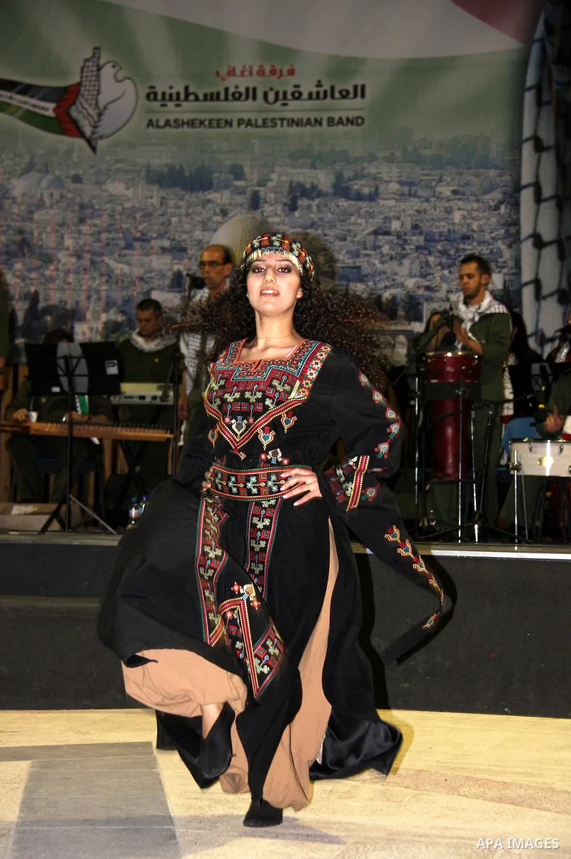 Palestinian musical band perform a traditional song during a concert commemorating the sixth anniversary of late Palestinian leader Yasser Arafat's death, in the West Bank city of Nablus, on Nov. 14, 2010. Photo by Wagdi...