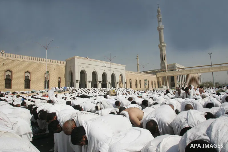 Muslim pilgrims pray near the Namira Mosque at Mount Arafat, southeast of the Saudi holy city of Mecca, on November 15, 2010. Pilgrims flooded into the Arafat plain from Mecca and Mina before dawn for a key ritual around...