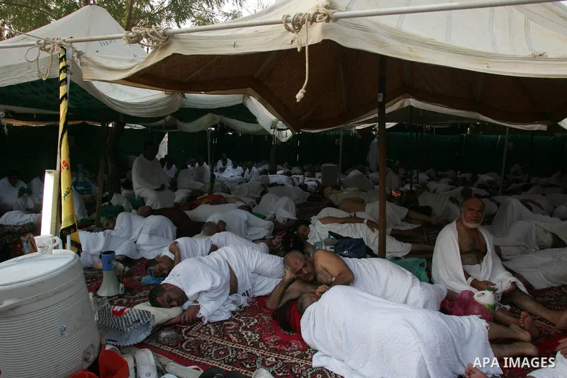 Muslim pilgrims stand at Mount Arafat, southeast of the Saudi holy city of Mecca, on November 15, 2010. Pilgrims flooded into the Arafat plain from Mecca and Mina before dawn for a key ritual around the site where prophe...