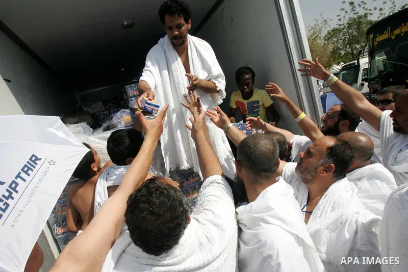Muslim pilgrims stand at Mount Arafat, southeast of the Saudi holy city of Mecca, on November 15, 2010. Pilgrims flooded into the Arafat plain from Mecca and Mina before dawn for a key ritual around the site where prophe...