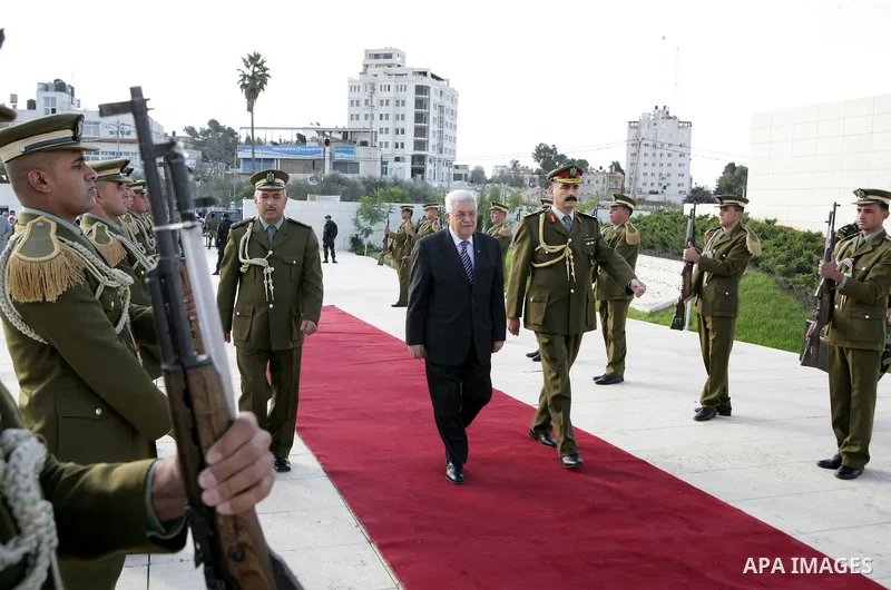 Palestinian President Mahmoud Abbas (Abu Mazen) lays a wreath at the grave of the late leader Yassir Arafat on the first day of Eid al-Adha in the West Bank city of Ramallah on Nov.16,2010. Muslims around the world celeb...
