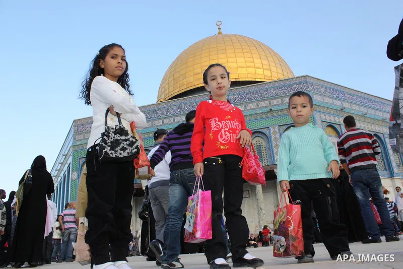 Palestinian Muslims attend prayers at the Al-Aqsa Mosque compound in Jerusalem on the first day of Eid al-Adha on Tuesday Nov. 16, 2010. Photo by Mohammed Alfateh